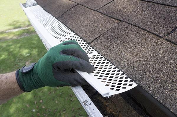 gutter guards work by covering the gutter opening to prevent debris from entering